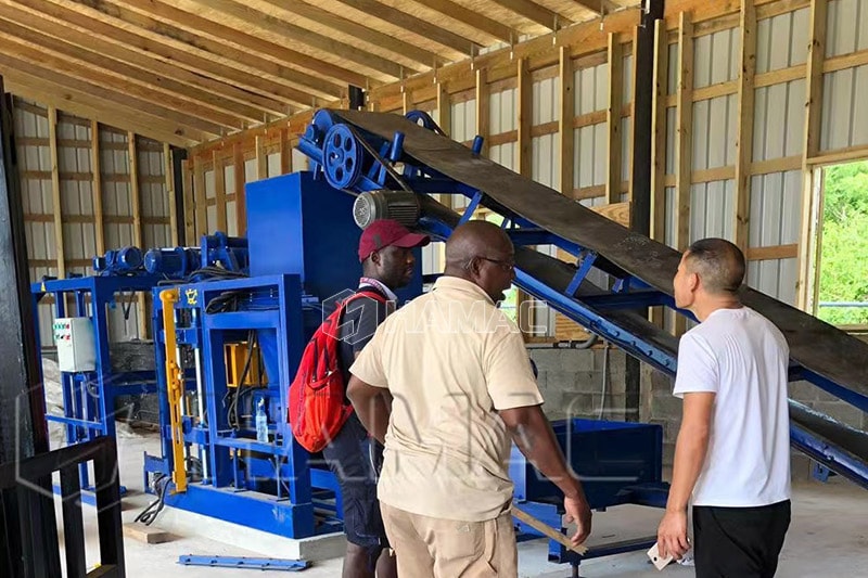 HAMAC technician is guiding the client to operate the block maing machine