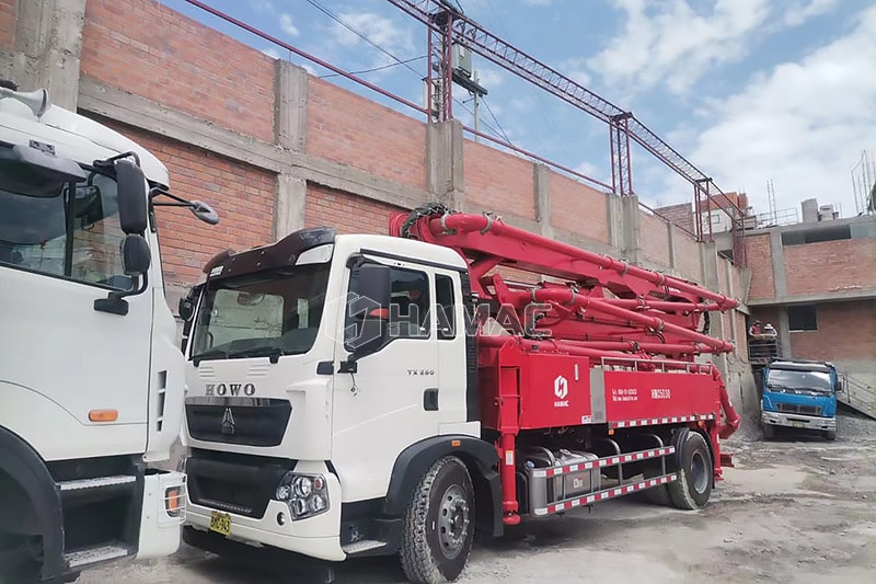 HMC5030 Truck mounted concrete boom pump arrived at the working site. 