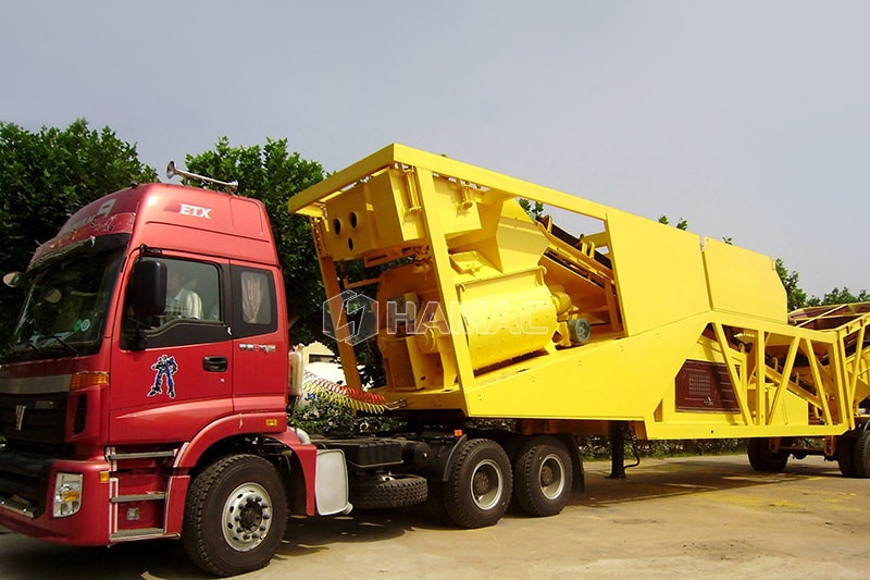 Mobile concrete batching plant is being towed as a complete system