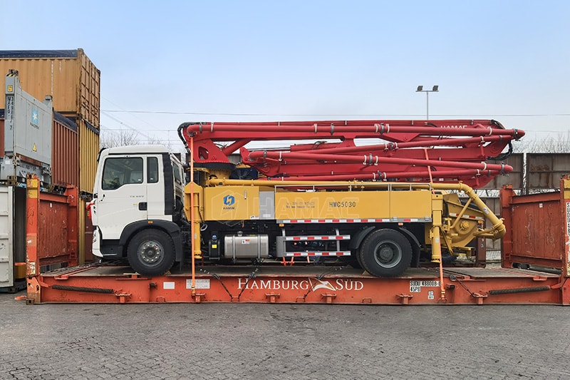 Concrete boom pump delivered by Flat Rack