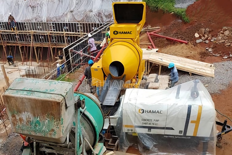 Two units diesel concrete mixer work together with diesel concrete pump at site